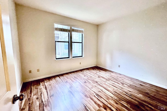 unfurnished room featuring light hardwood / wood-style flooring