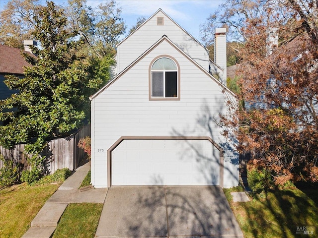 view of property exterior with a garage