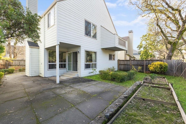 rear view of property with a patio