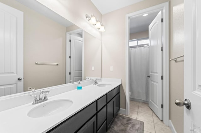 bathroom featuring a shower with curtain, vanity, toilet, and tile patterned flooring