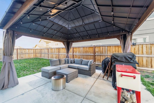 view of patio / terrace with an outdoor living space, a gazebo, and a grill