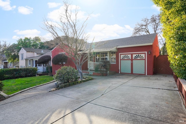 view of front of house with a front lawn and a garage