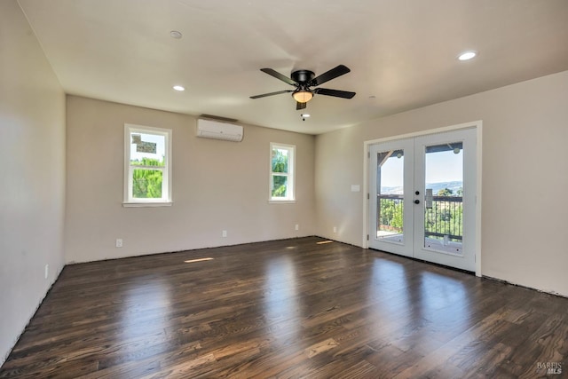 spare room with french doors, dark wood-type flooring, and a wealth of natural light