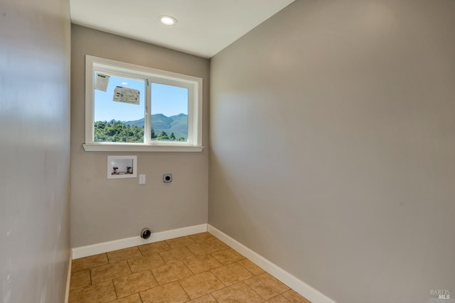 laundry area featuring hookup for a washing machine, a mountain view, electric dryer hookup, laundry area, and baseboards