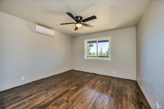 unfurnished room with dark wood-style floors, a wall mounted air conditioner, and ceiling fan