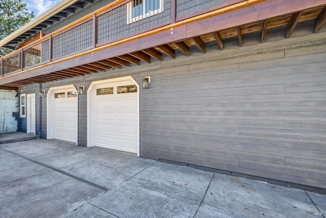 garage with concrete driveway