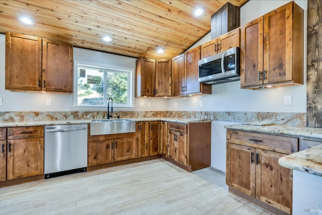 kitchen featuring appliances with stainless steel finishes, wood ceiling, brown cabinets, and a sink