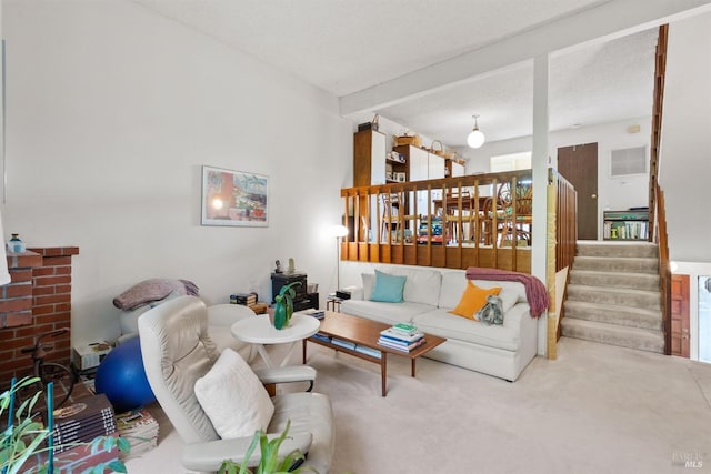 living room with beamed ceiling and carpet floors