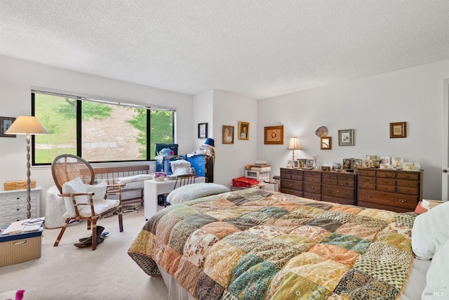 carpeted bedroom with a textured ceiling