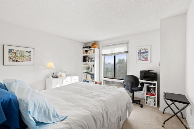 carpeted bedroom featuring a textured ceiling