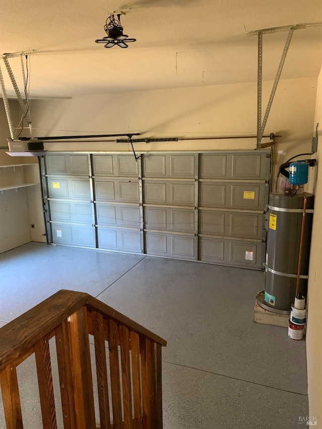 garage with a garage door opener and strapped water heater