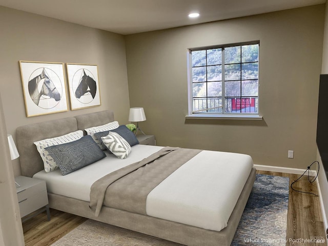 bedroom featuring wood-type flooring