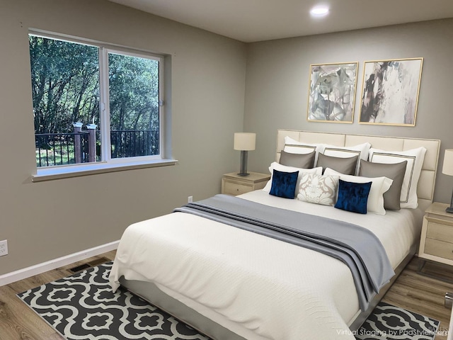 bedroom with hardwood / wood-style flooring