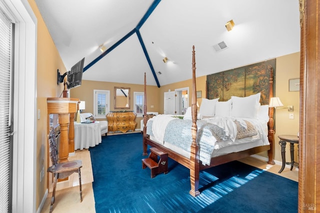 bedroom featuring carpet flooring and lofted ceiling