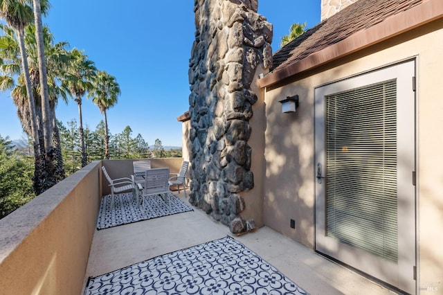 view of patio with a balcony