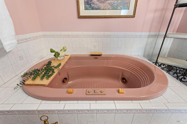 bathroom with tiled bath