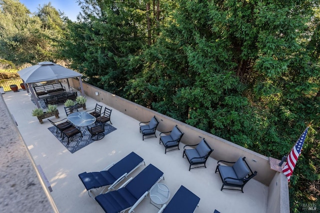 view of patio with a gazebo and outdoor lounge area