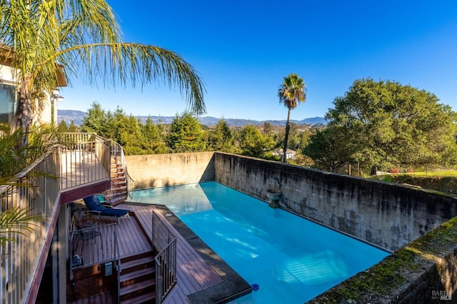 view of swimming pool featuring a mountain view