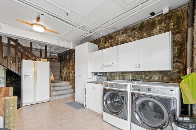 laundry area featuring cabinets and separate washer and dryer