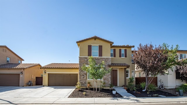 mediterranean / spanish-style home featuring a garage