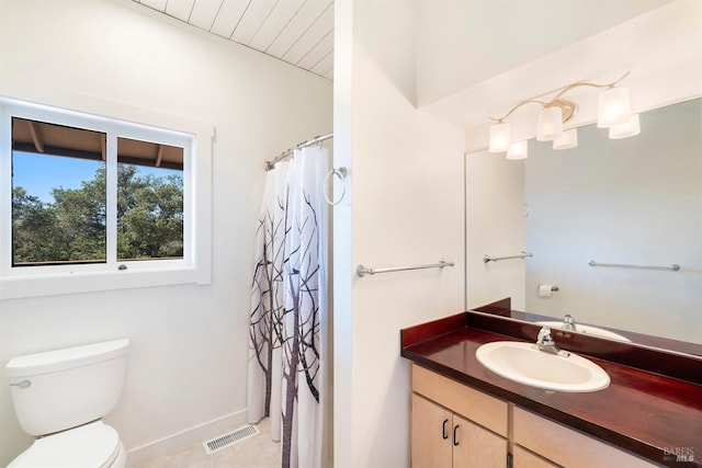 bathroom with walk in shower, vanity, and toilet