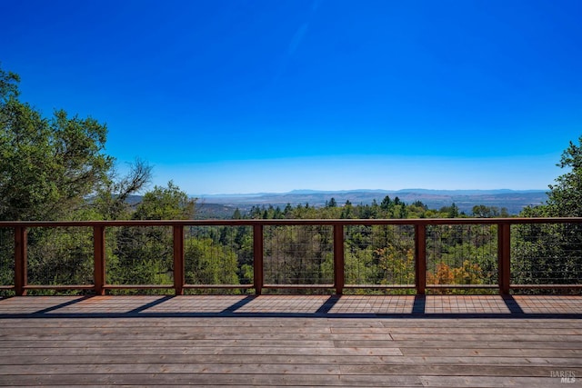 wooden deck with a mountain view