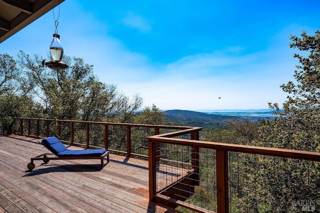 wooden terrace with a mountain view