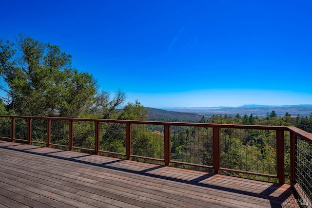 wooden deck with a mountain view