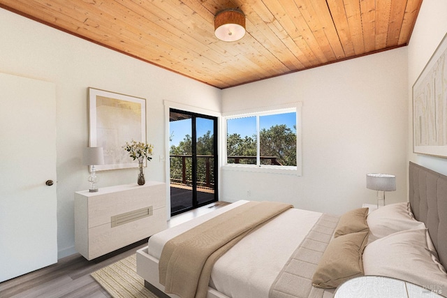 bedroom featuring access to exterior, ornamental molding, wood ceiling, and hardwood / wood-style flooring