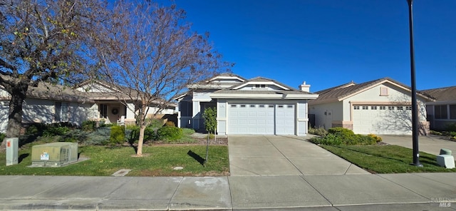 ranch-style home featuring a garage and a front lawn