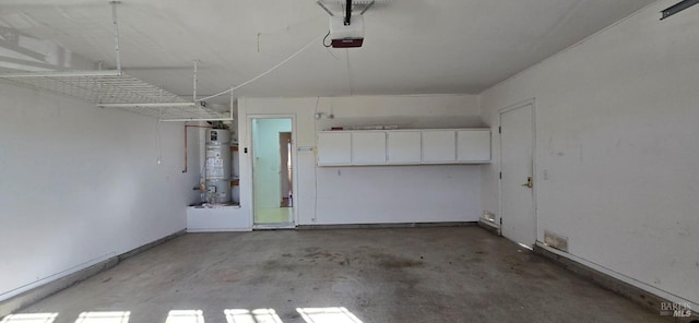 garage featuring secured water heater and a garage door opener