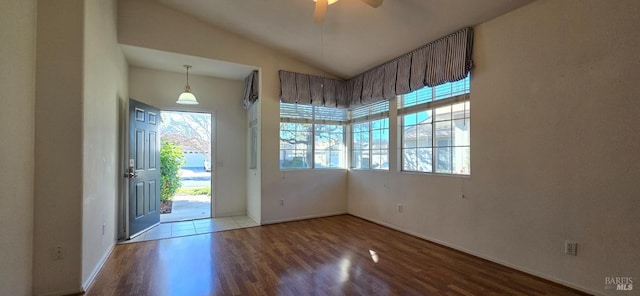 interior space featuring hardwood / wood-style flooring, ceiling fan, and lofted ceiling