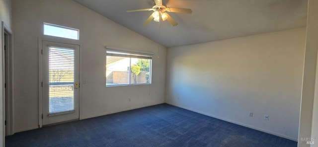 carpeted spare room with ceiling fan and lofted ceiling