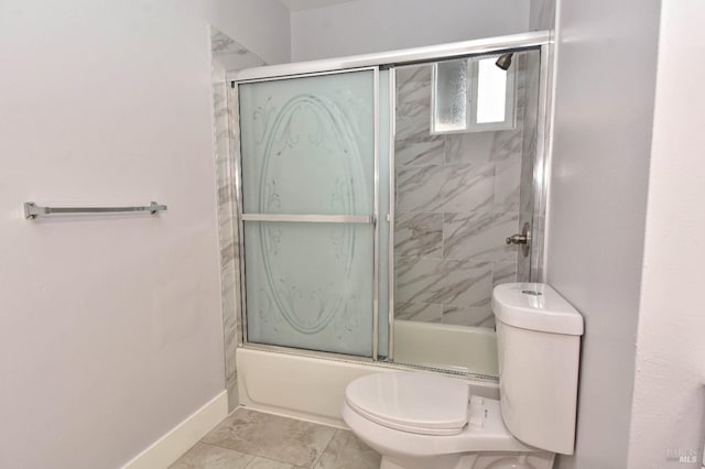 full bathroom with enclosed tub / shower combo, toilet, and baseboards