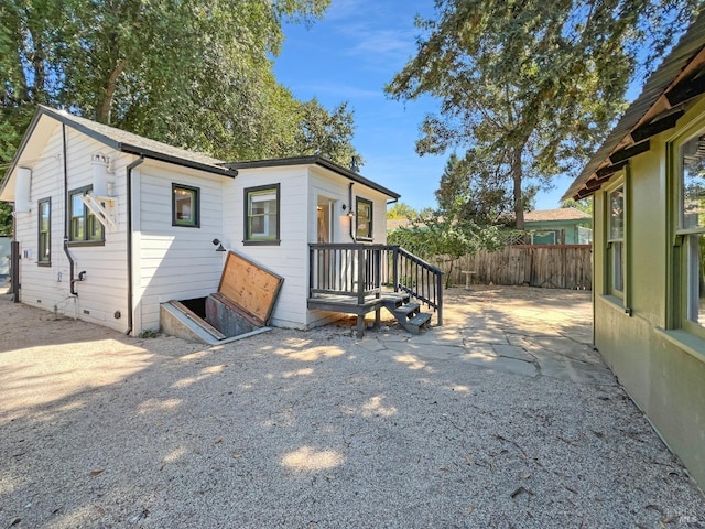 rear view of property featuring a patio area