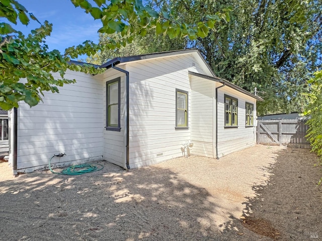 view of side of property with a patio