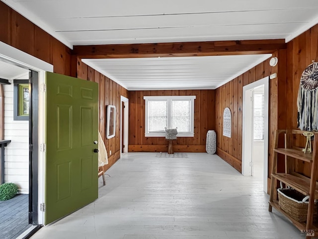 entrance foyer featuring wooden walls