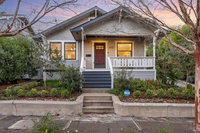 bungalow-style house featuring covered porch