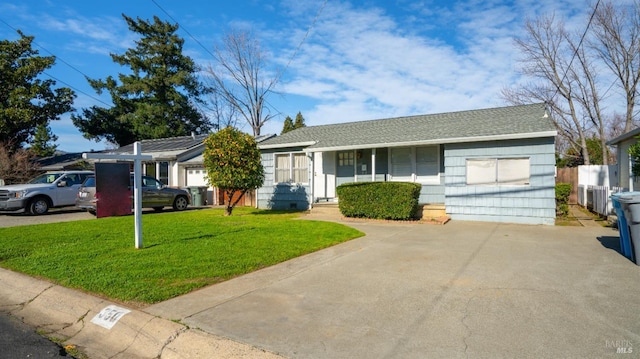 ranch-style house with a garage and a front yard