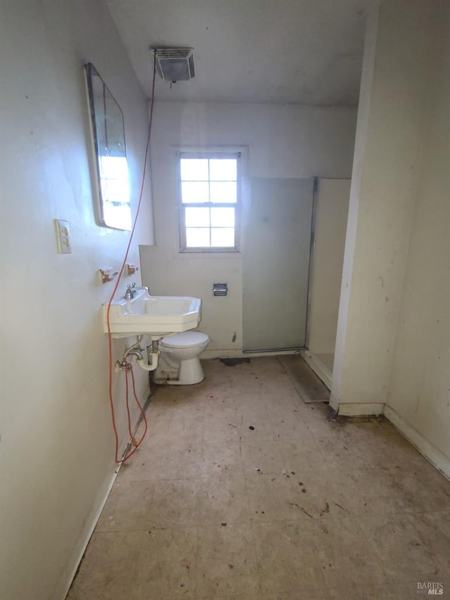 bathroom featuring sink and toilet