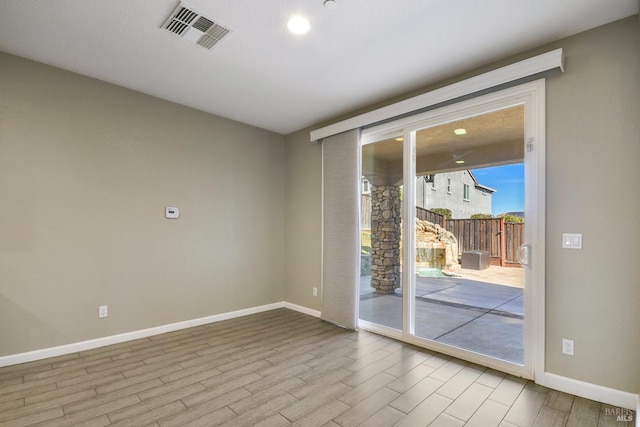 unfurnished room featuring light hardwood / wood-style flooring