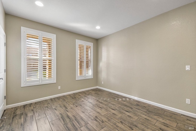 empty room featuring wood-type flooring