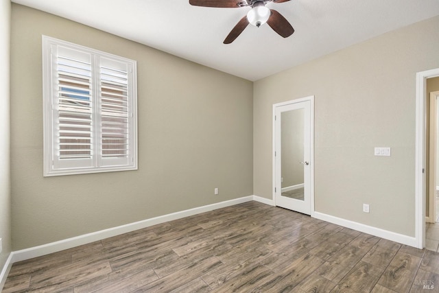 unfurnished room featuring hardwood / wood-style flooring and ceiling fan