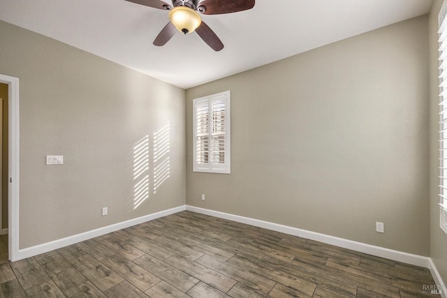 empty room featuring hardwood / wood-style floors and ceiling fan