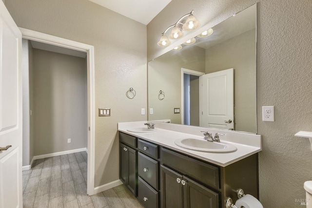 bathroom with hardwood / wood-style floors and vanity