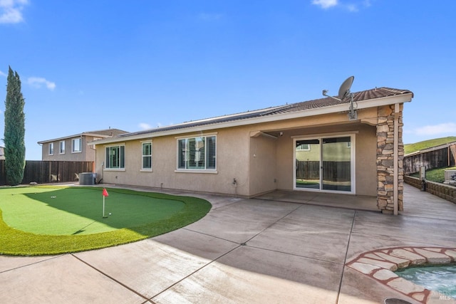 back of property with a patio and cooling unit