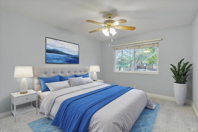 bedroom featuring ceiling fan and light carpet