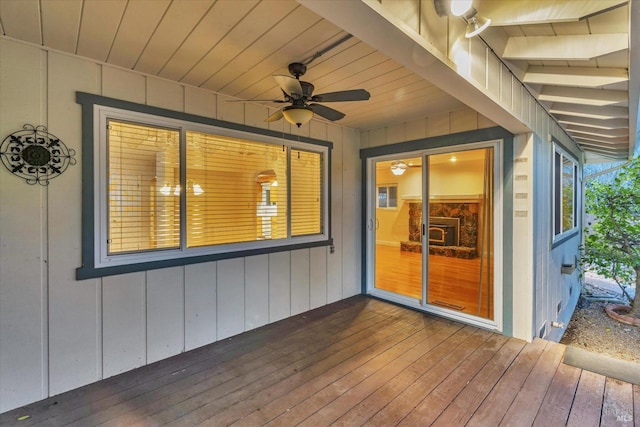 wooden terrace featuring ceiling fan