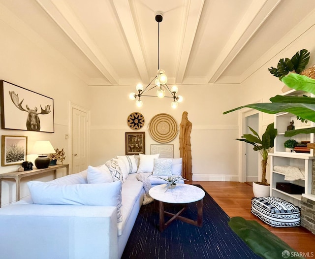 living room featuring beamed ceiling, an inviting chandelier, and wood finished floors