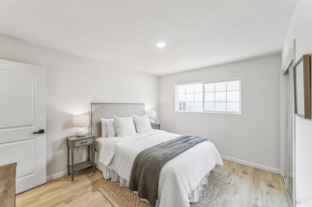 bedroom with light hardwood / wood-style floors